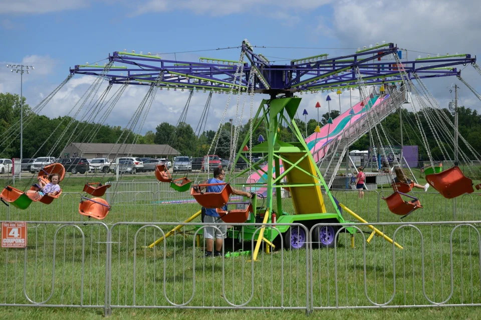 Carnival ride spinning on the festival grounds