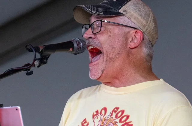 Crooked Highway vocalist singing into a microphone