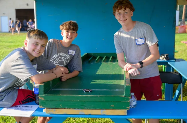 Volunteers at a midway game booth