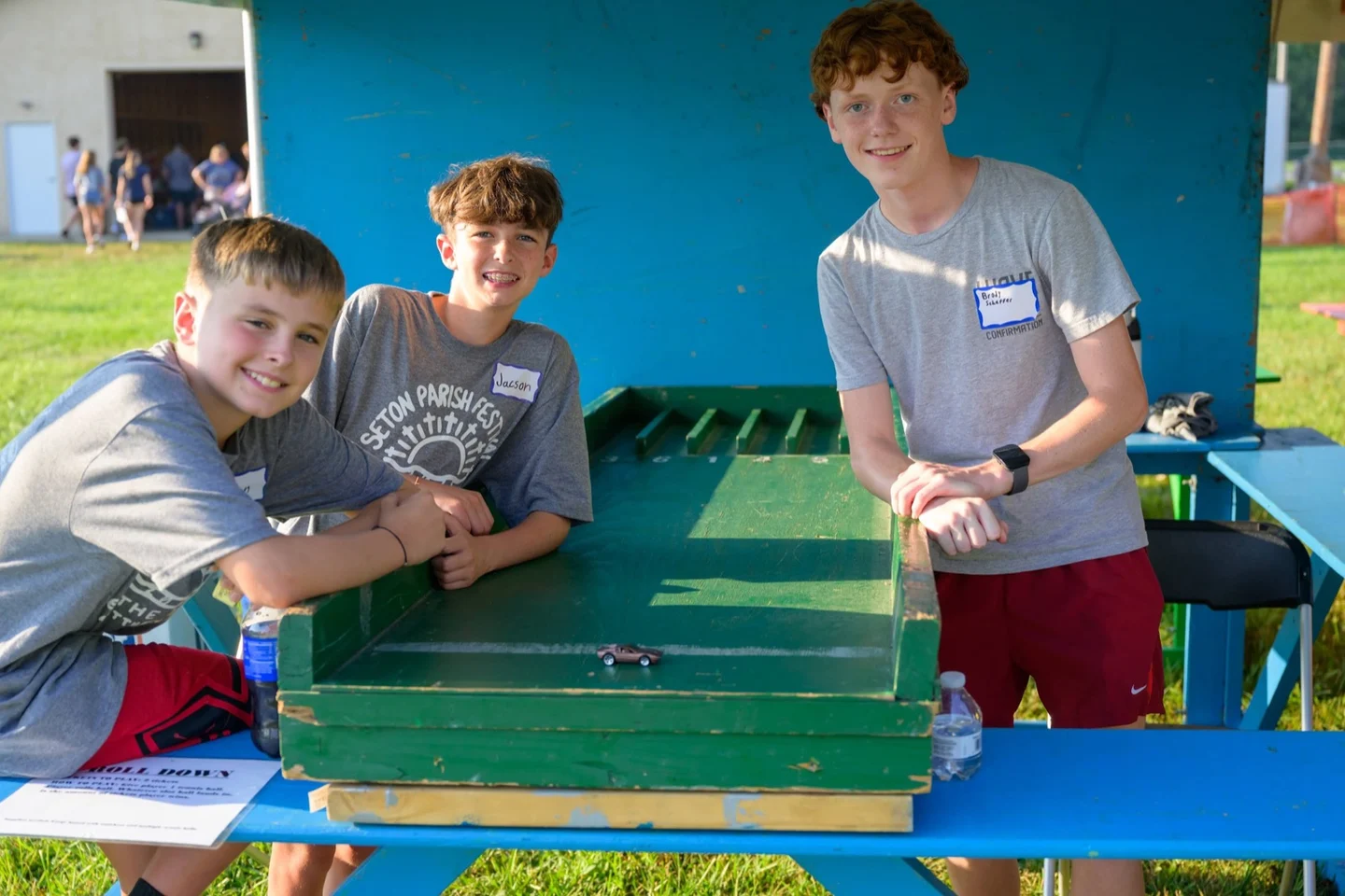 Volunteers at a midway game booth